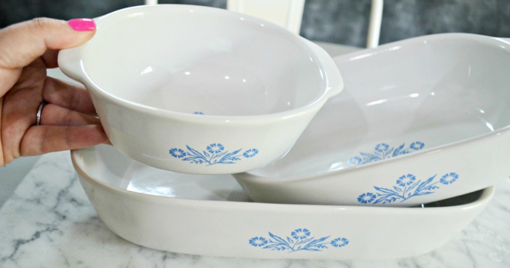 hand holdig vintage corningware bowl