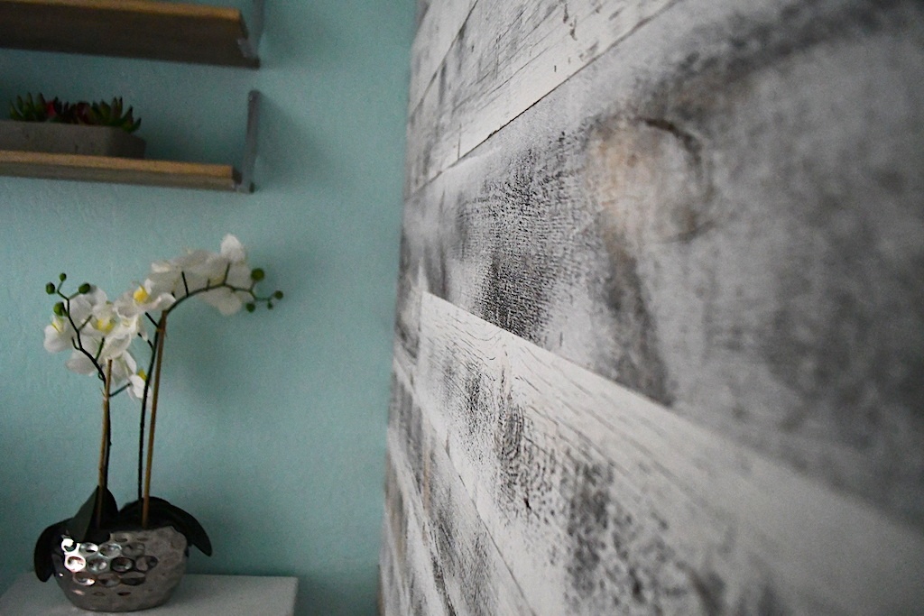 wood plank accent wall in bathroom 