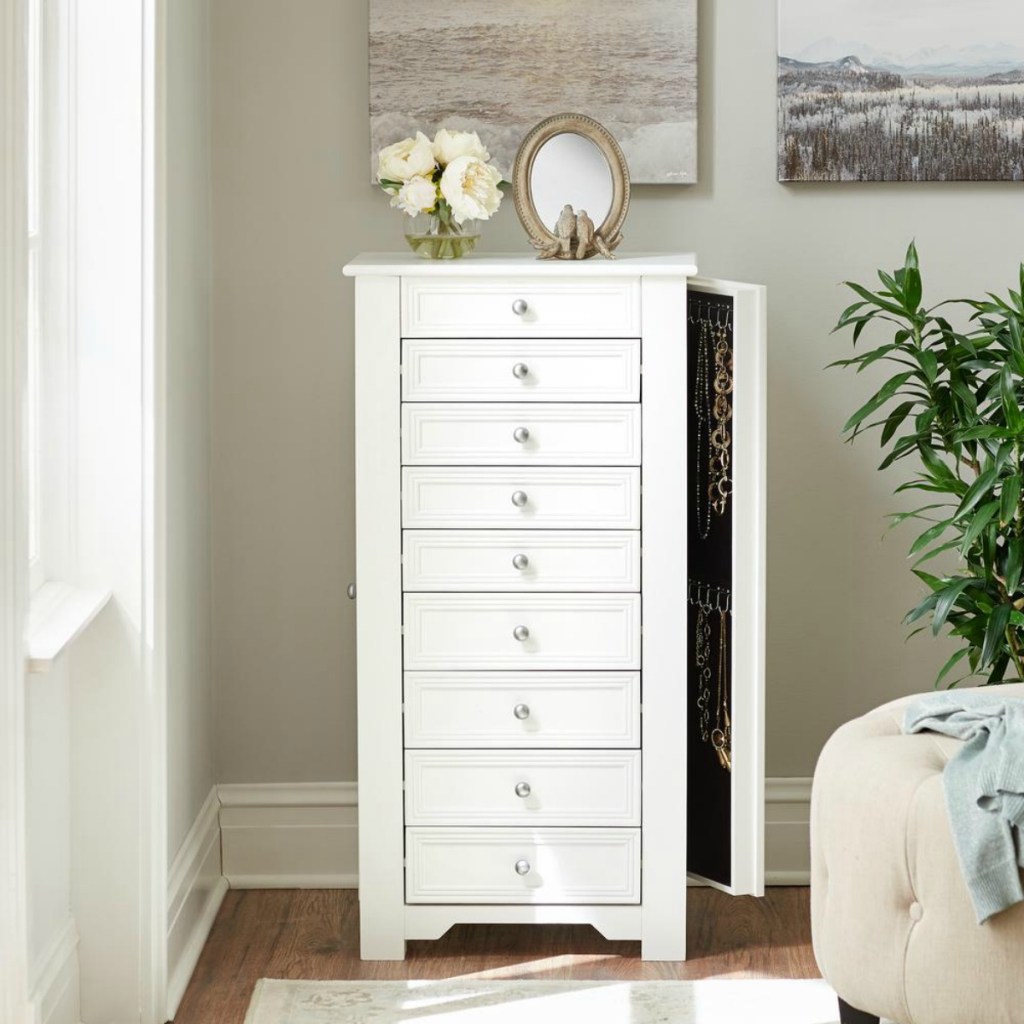 white jewelry armoire in room