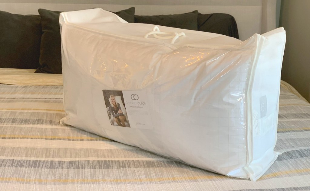 white pillows in bag sitting on bed