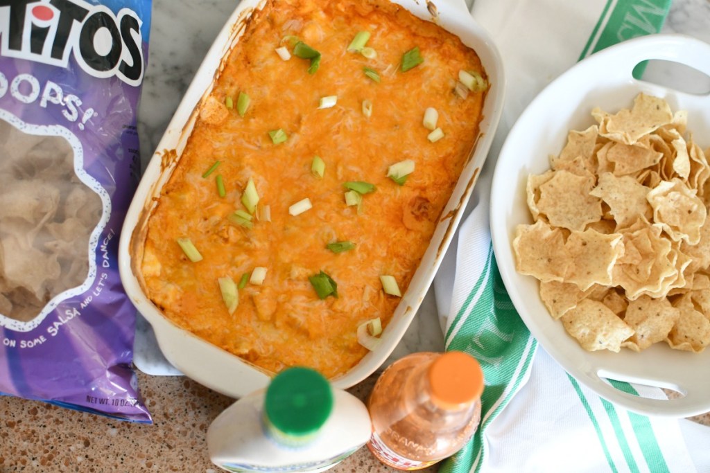 buffalo chicken dip in a casserole dish on the counter 