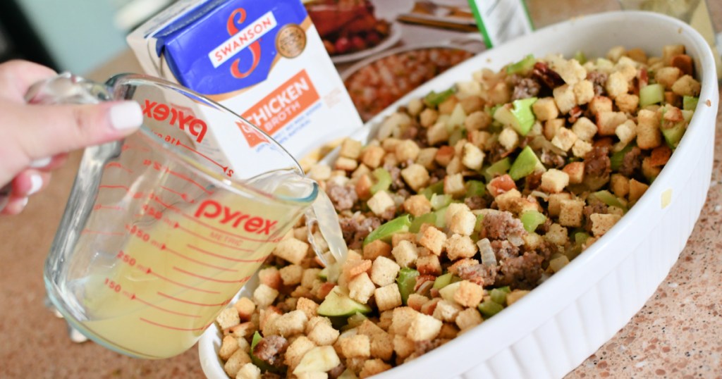 pouring broth onto stuffing