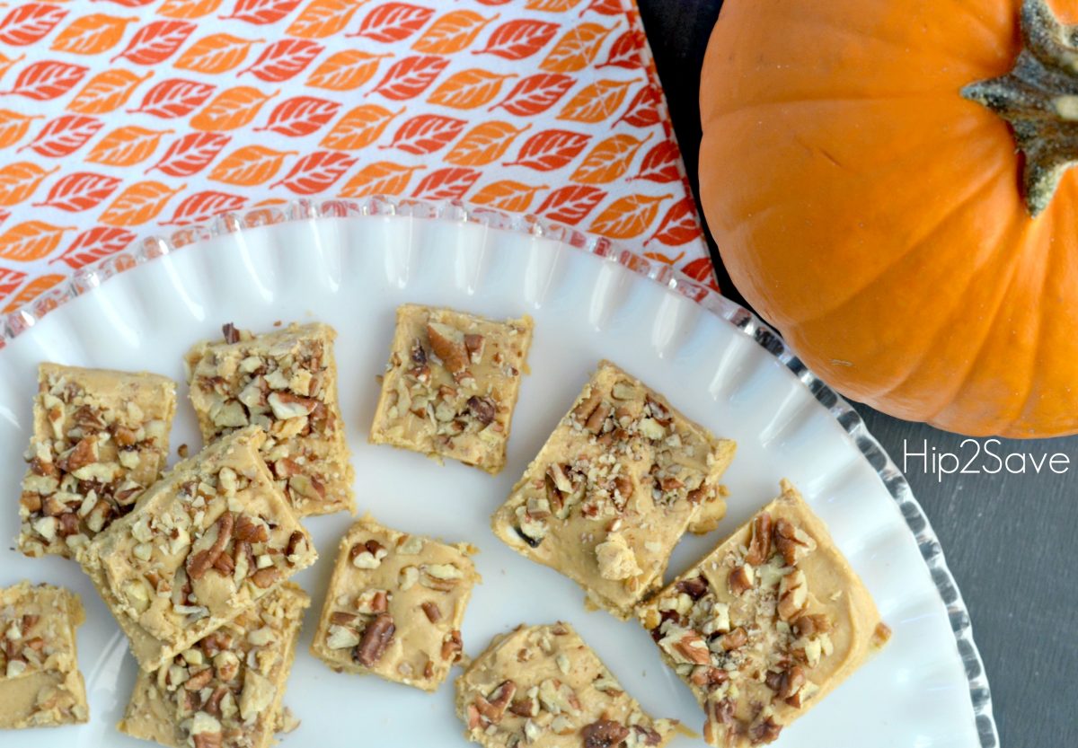 Pumpkin Fudge arranged on a plate next to a pumpkin