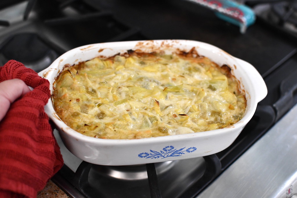 baked artichoke dip on top of oven 