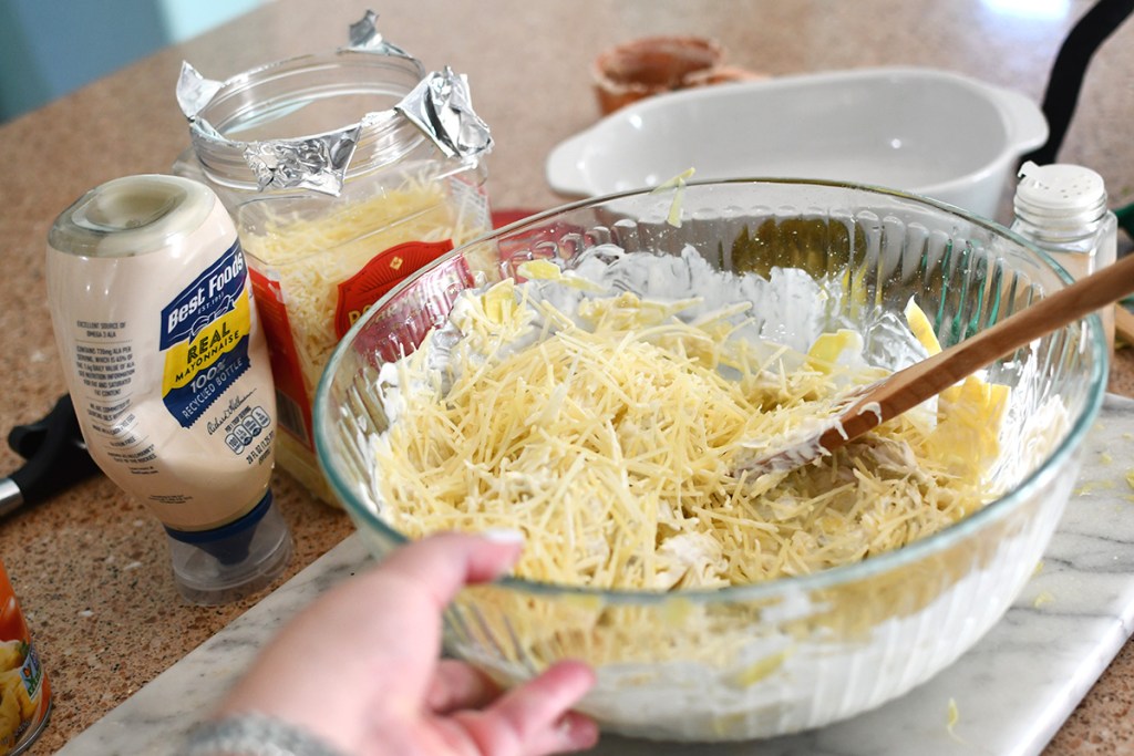 mixing parmesan cheese into dip