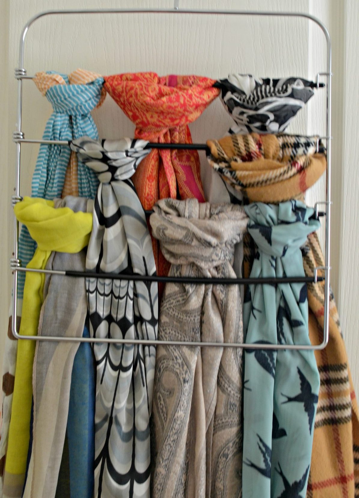 Use a pant hanger to organize scarves Hip2Save