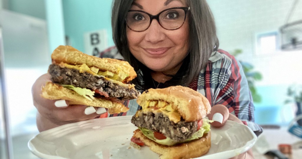 woman holding a black bean burger 