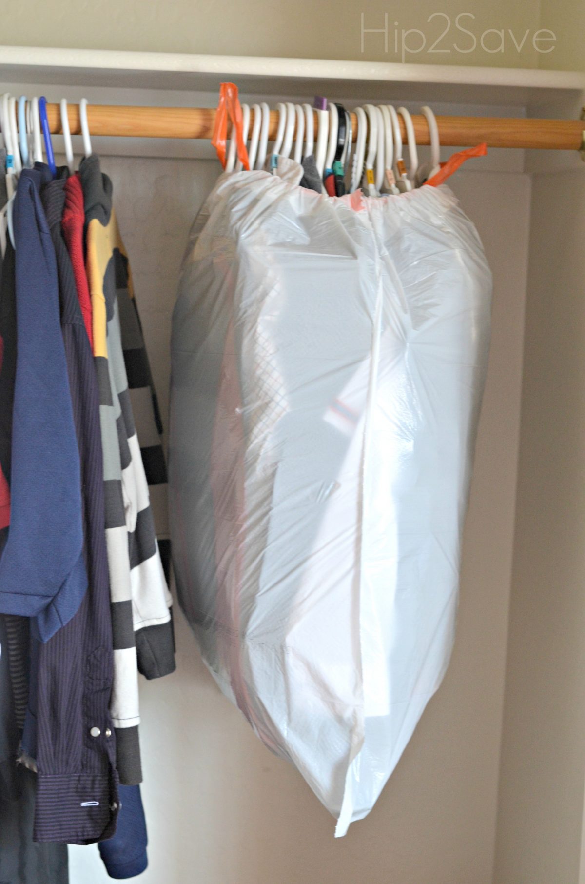 Use a garbage bag for hanging clothes Hip2Save