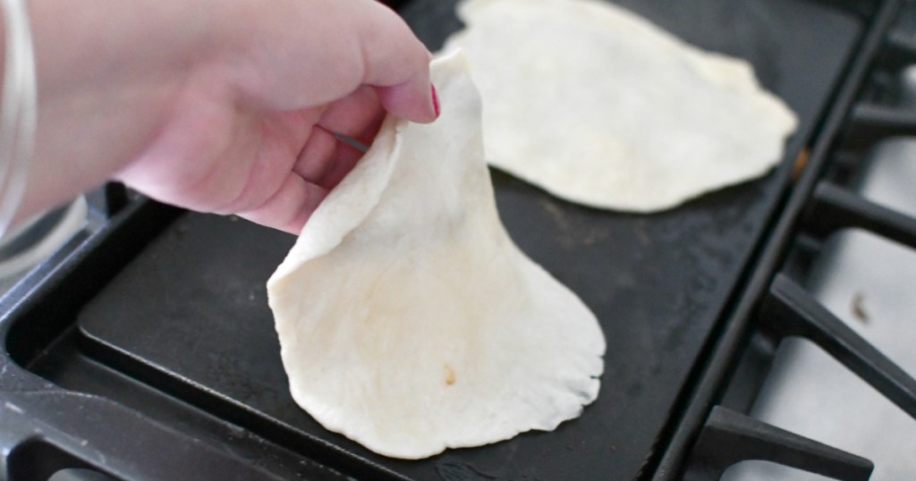 cooking tortillas on a griddle