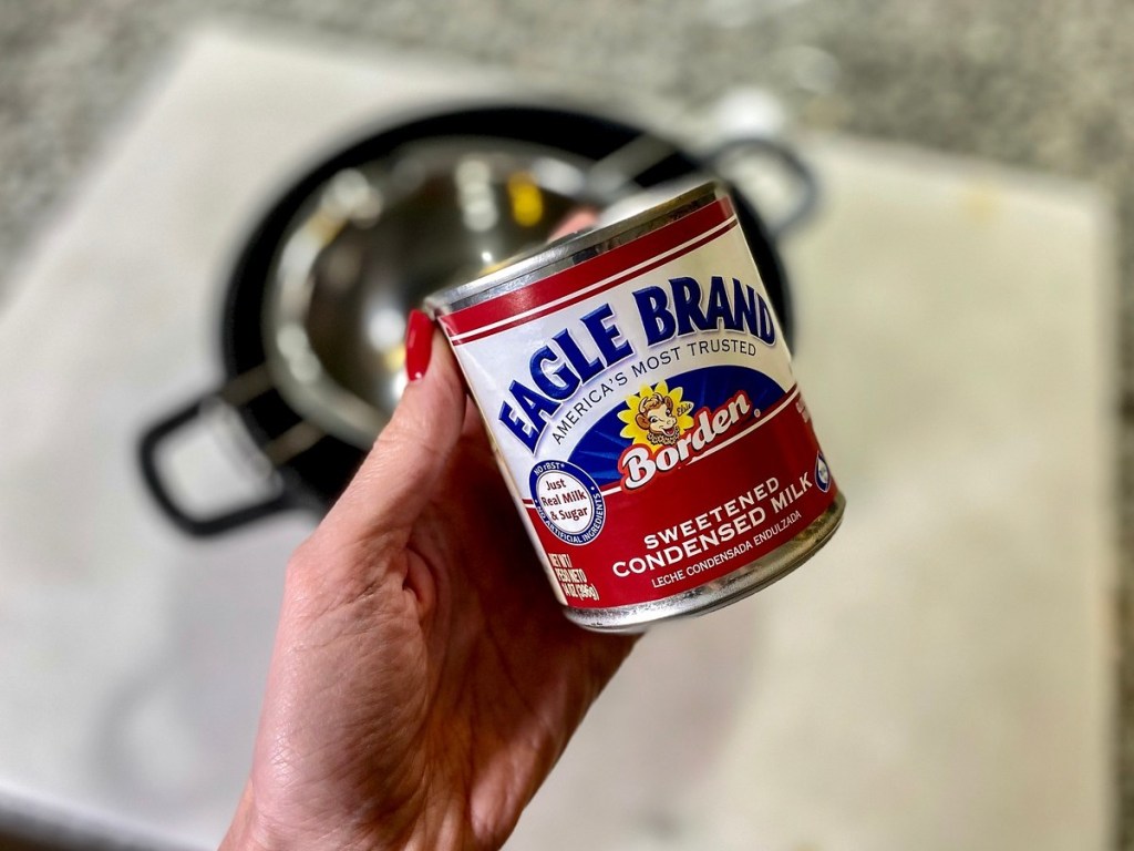 hand holding can of Eagle Brand condensed milk