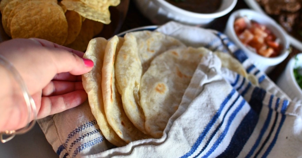 picking up homemade flour tortilla 