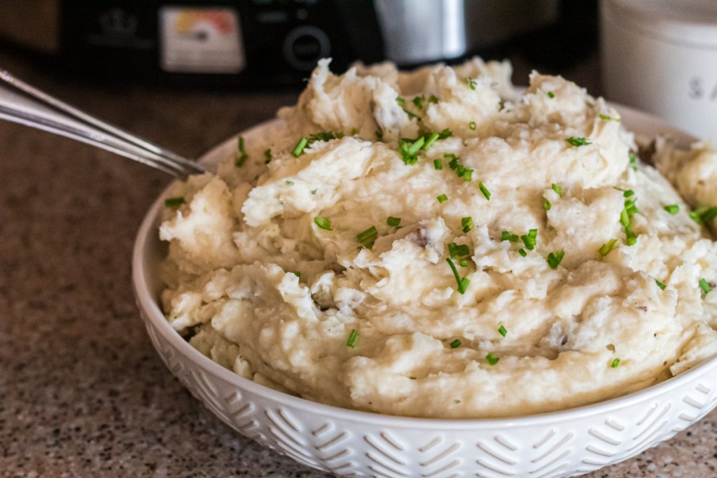 a bowl full of mash potatoes