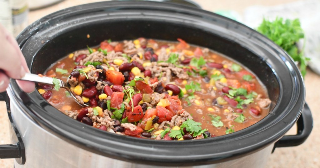 stirring taco ranch soup in slow cooker 