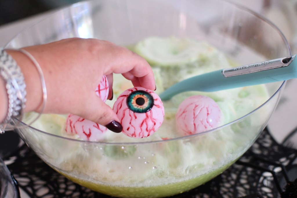 adding zombie eyes to punch bowl