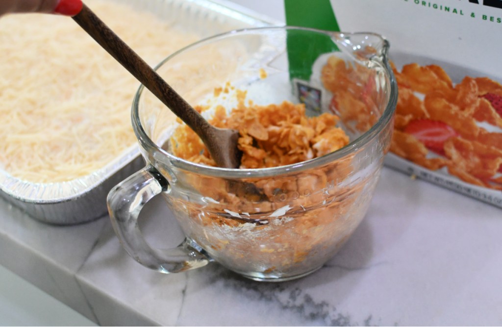 crushed corn flakes and butter in a small bowl