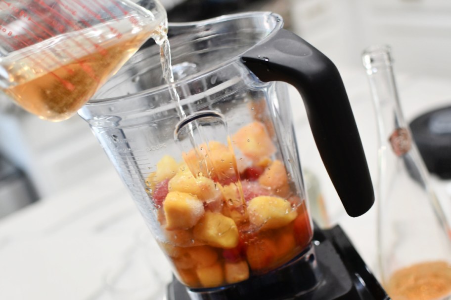 pouring wine in a blender