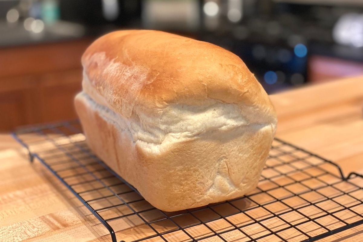 A loaf of bread on a baking rack