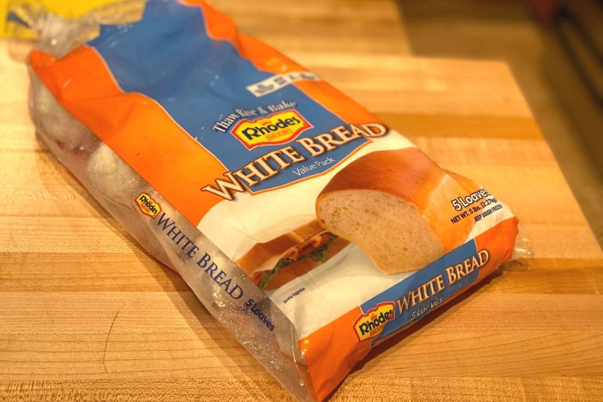 A bag of white frozen bread dough on a table