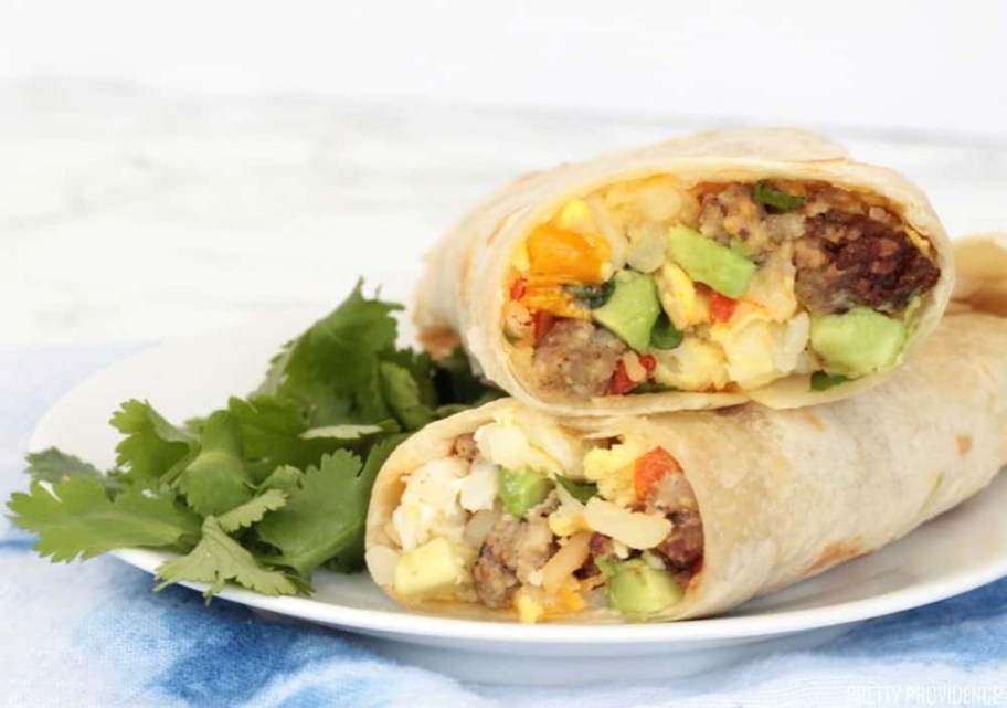 breakfast burrito on plate with cilantro