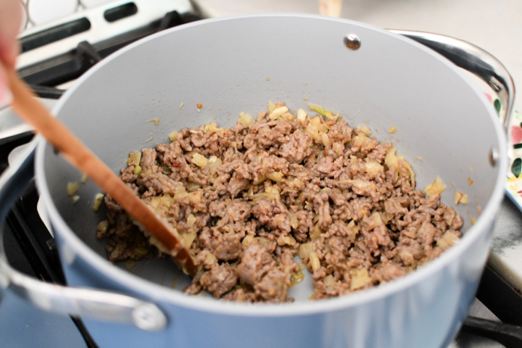 cooking ground sausage in a stock pot