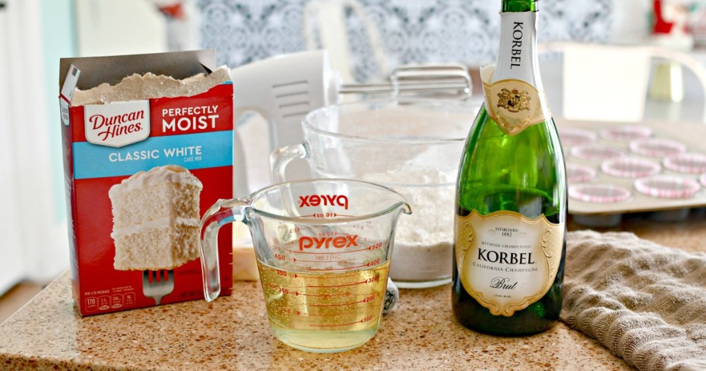 cake mix and champagne on the counter for cupcakes