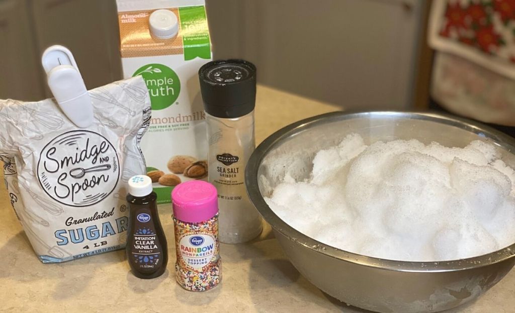 Ingredients to make ice cream with snow on a counter