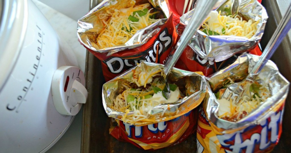 doritos and fritos bags filled with tacos on a tray