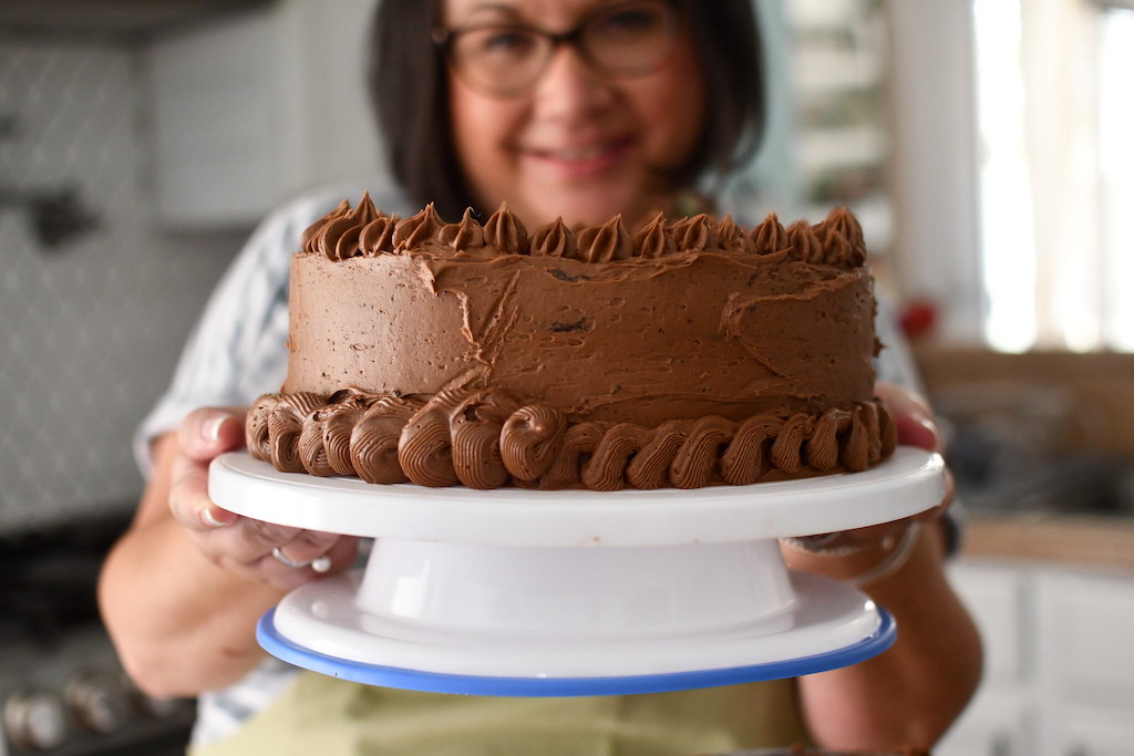 woman holding chocolate cake 