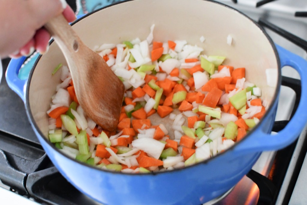 stirring veggies for chicken orzo soup