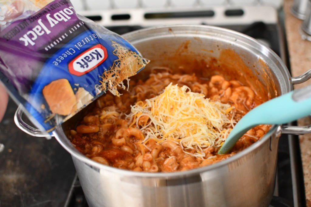 adding cheese to goulash