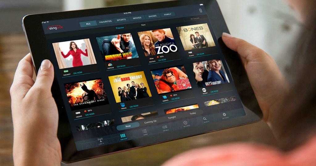 person watching Sling TV on tablet