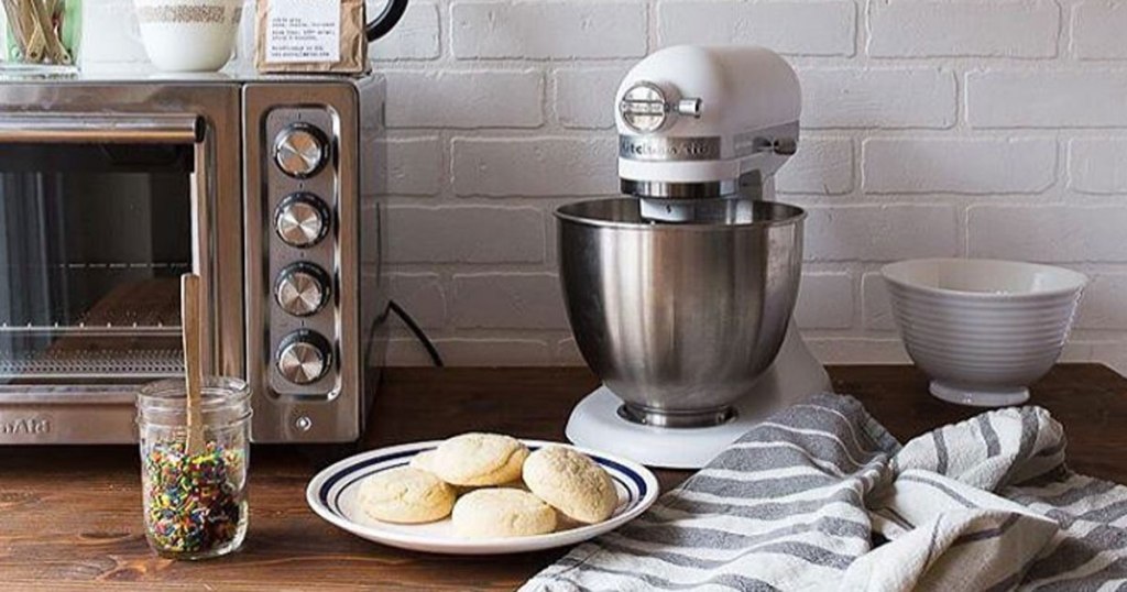 kitchenaid air fryer convection oven with white mixer on counter with sugar cookies