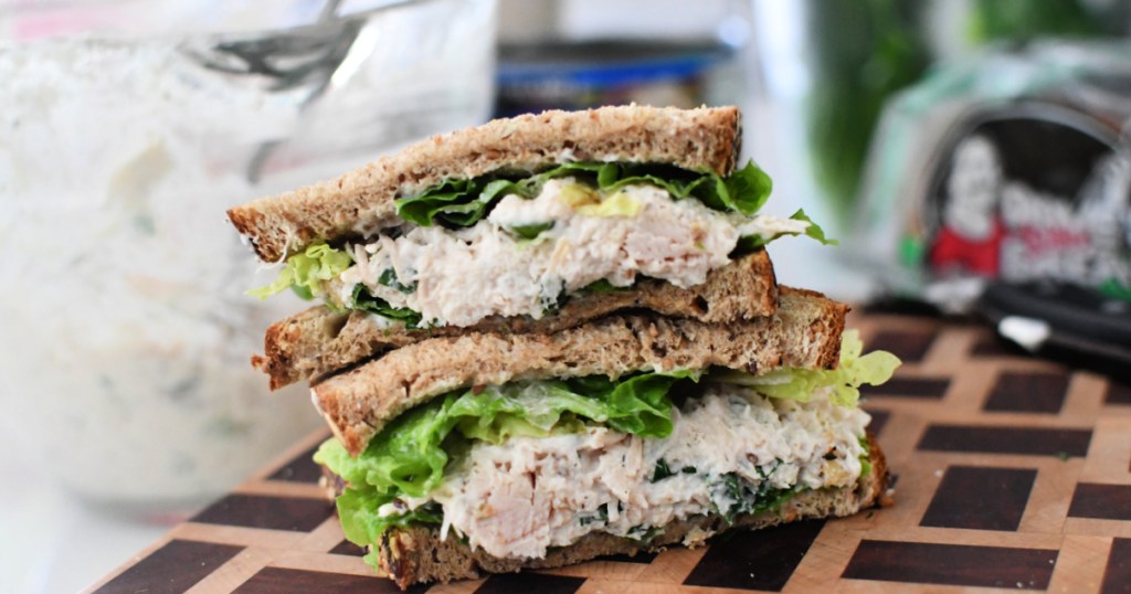 canned chicken salad sandwich on a cutting board