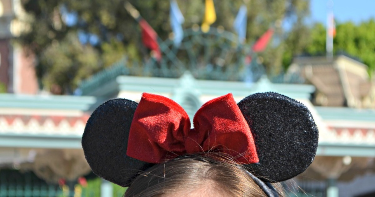 closeup of top of woman's head with Minnie Mouse ears
