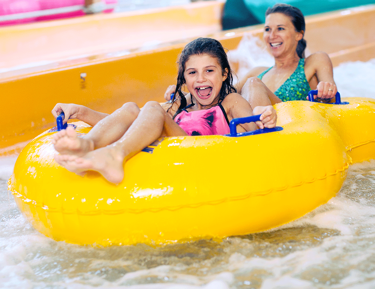 woman and girl on rafts in water