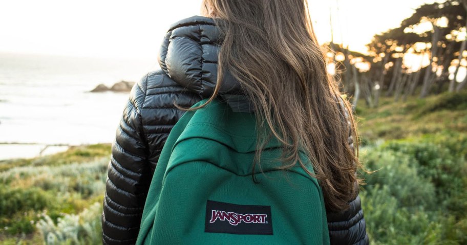 girl wearing jansport backpack