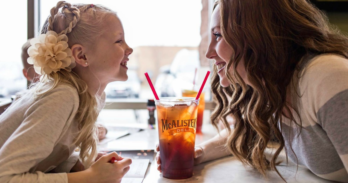 mcalisters deli young girl and lady smiling at each other