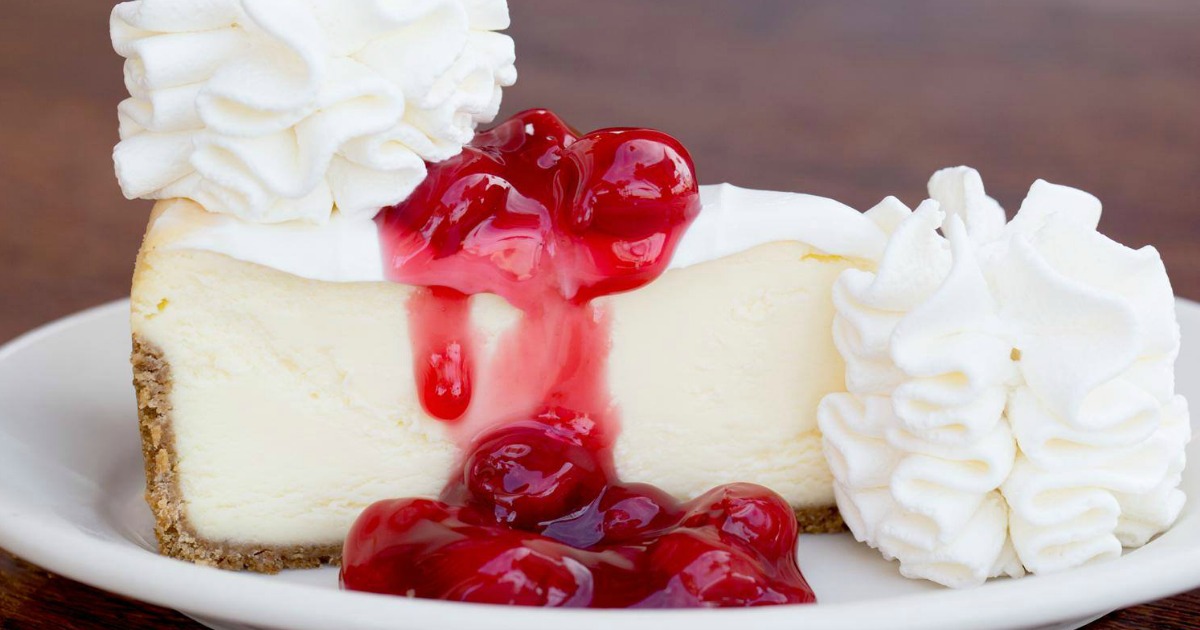 Cheesecake with cherries and whipped cream 