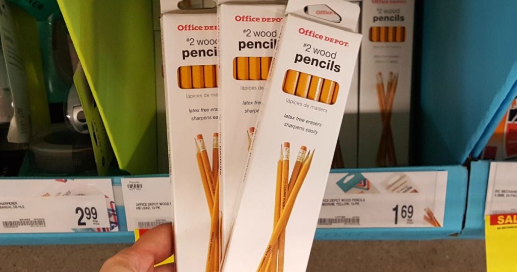hand holding boxes of pencils in store