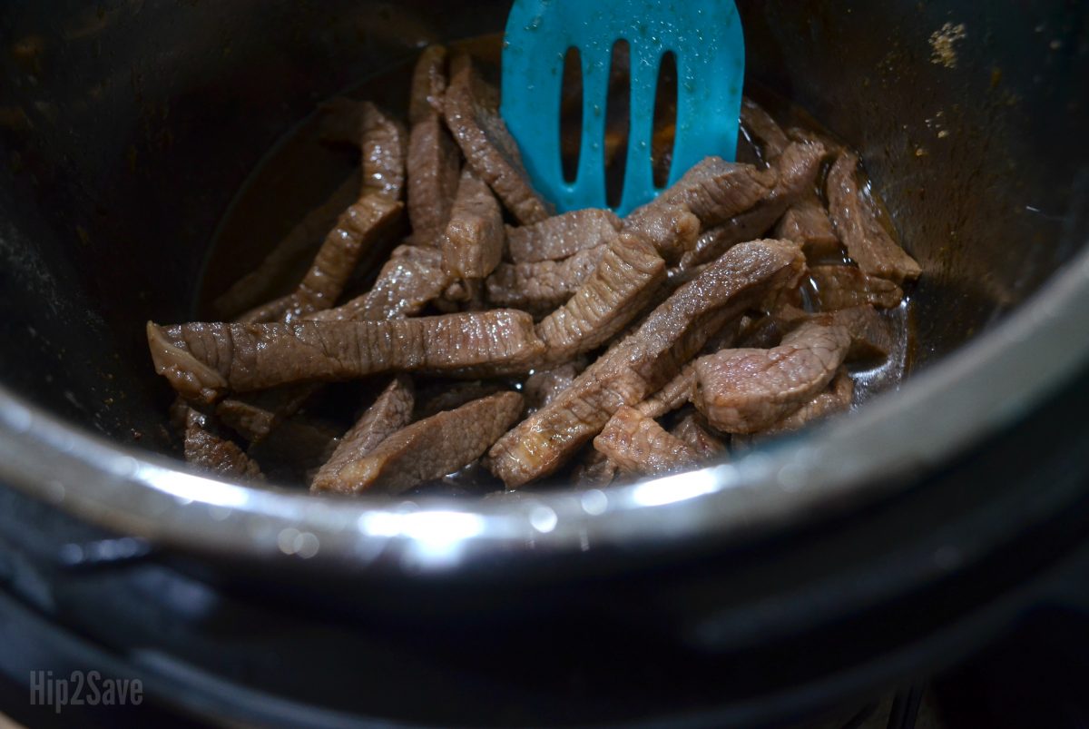 Mongolian Beef in the instant pot being stirred