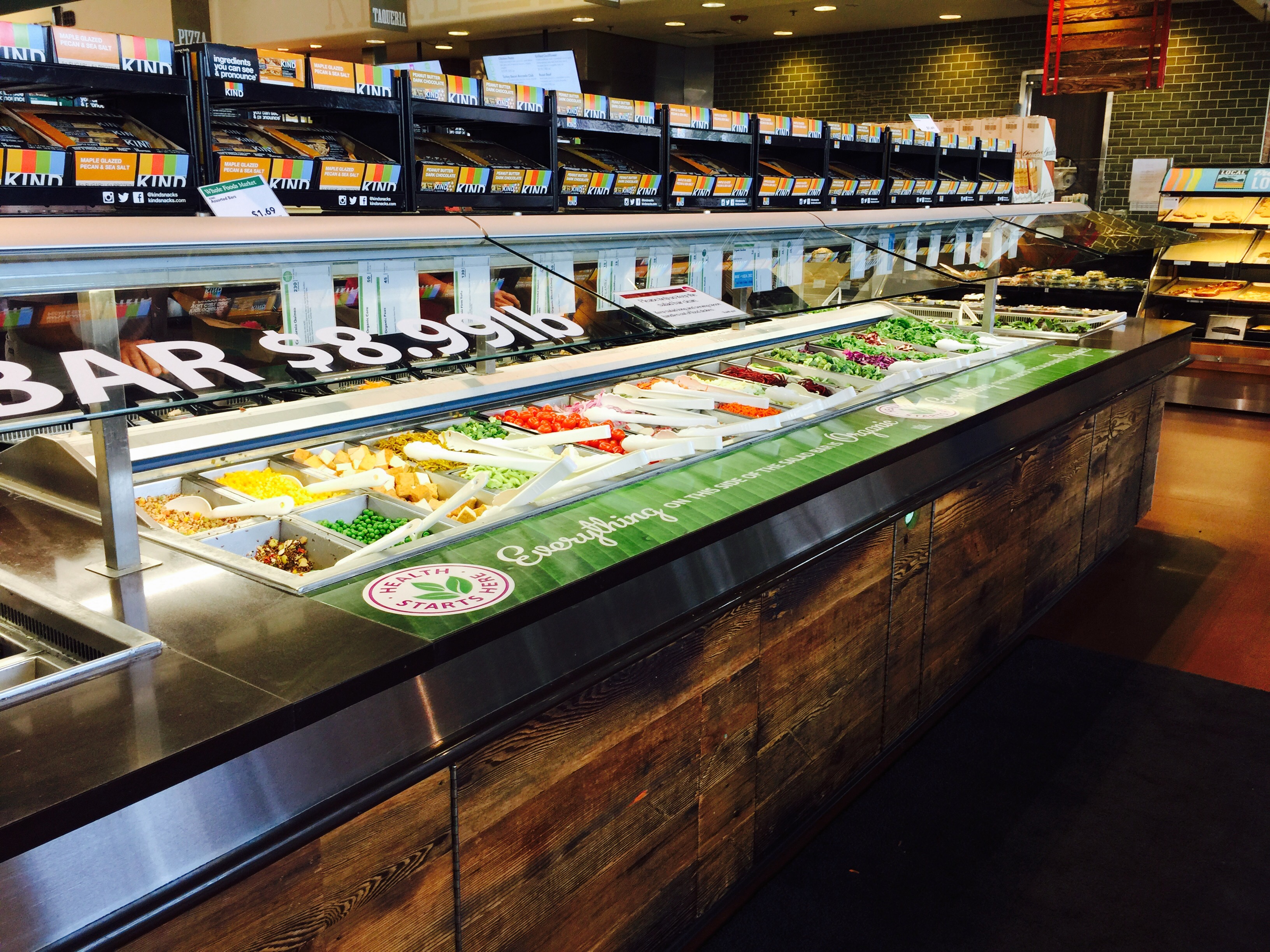 money-saving hacks at Whole Foods Market – side view of the olive and salad bar