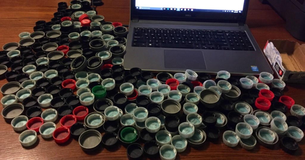 computer with coke rewards lids