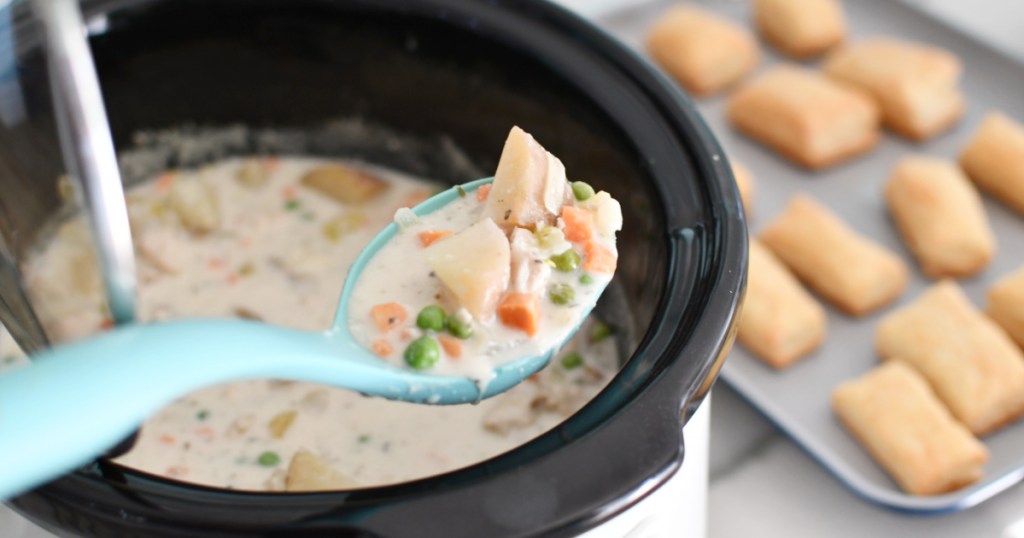 spoon with slow cooker chicken pot pie soup