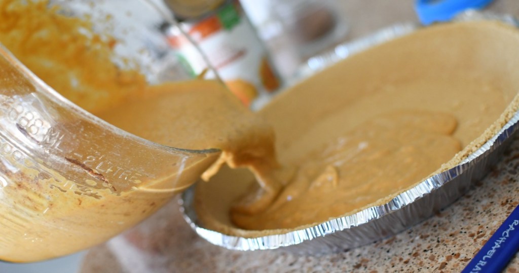 pouring in a pumpkin pie