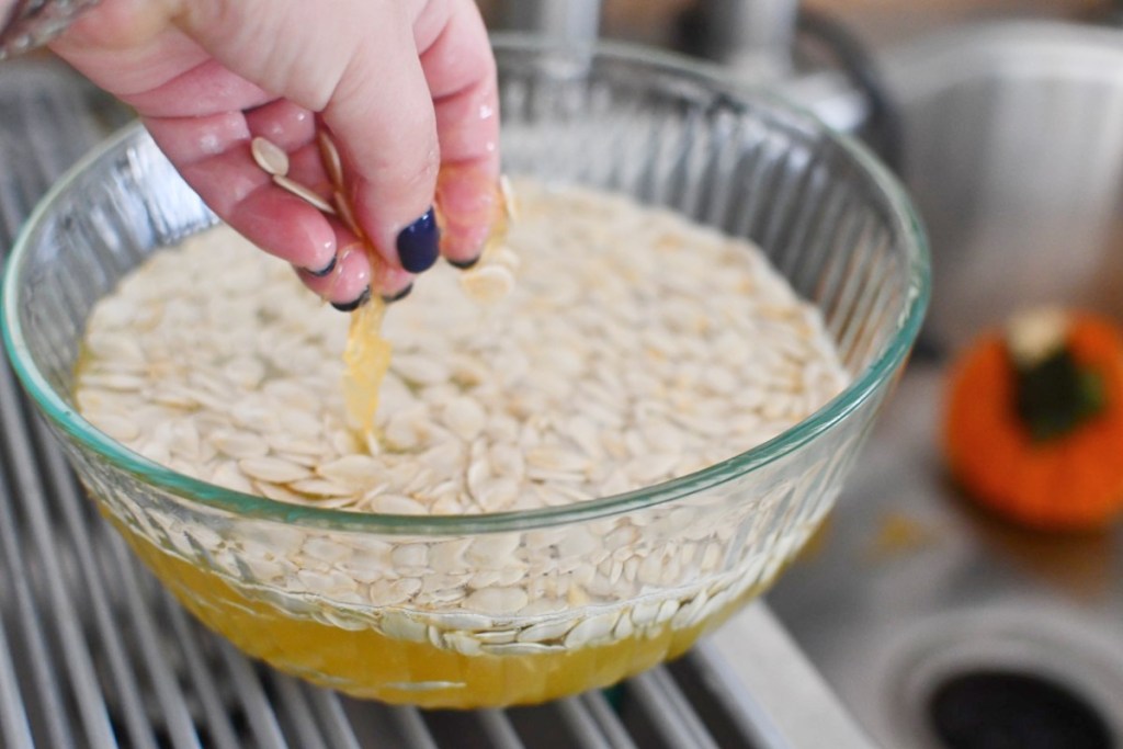 pumpkin seeds in bowl of water