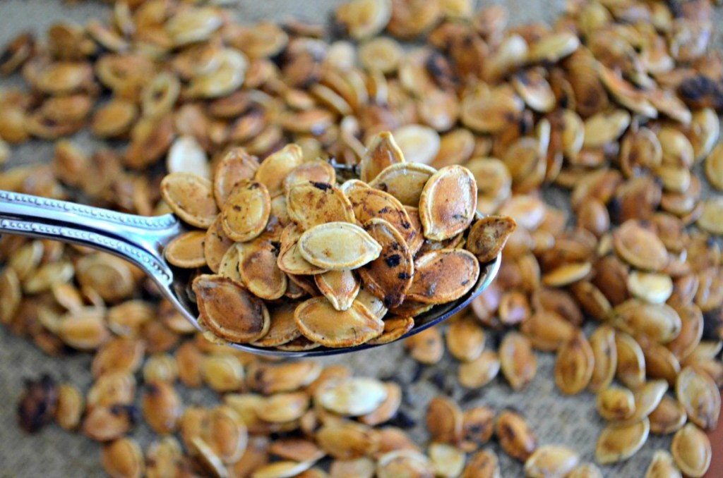 spooning up roasted pumpkin seeds