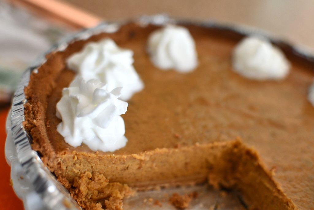 large slice out of pumpkin pie