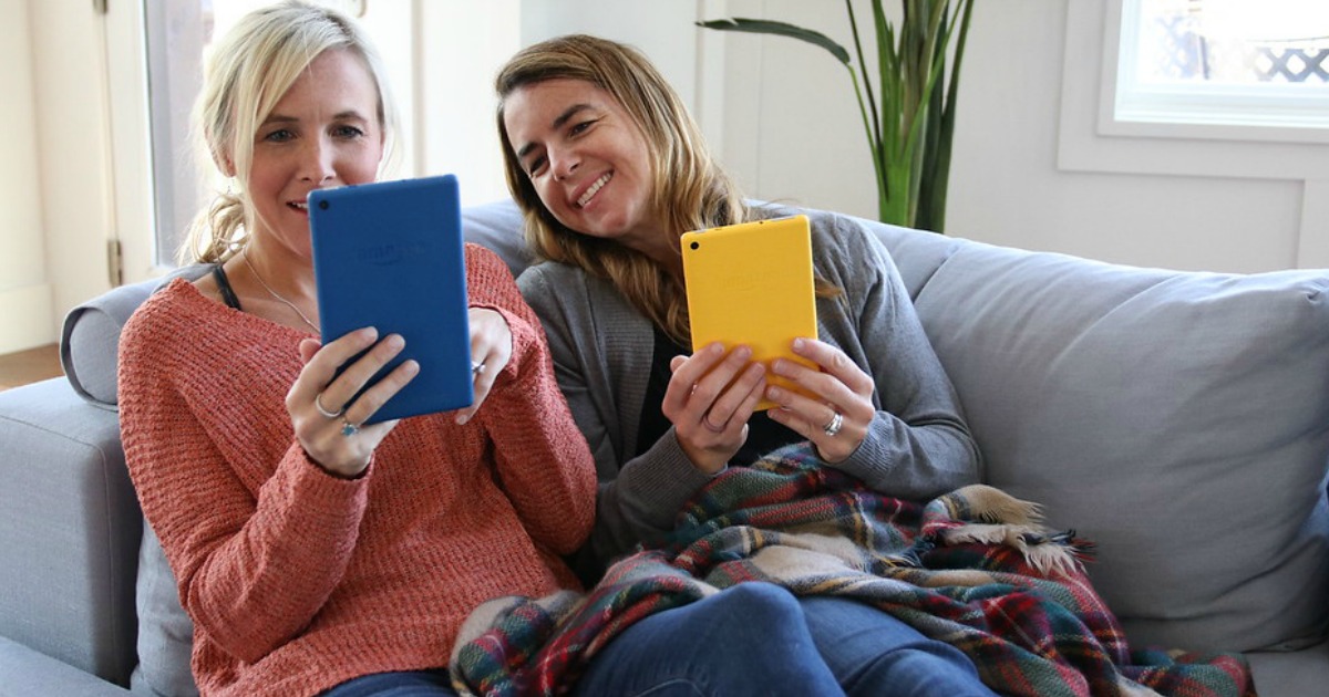 two women looking at their kindles