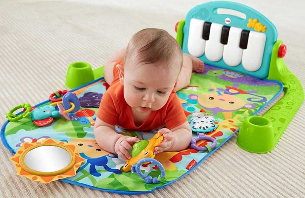 baby on piano learning pad 