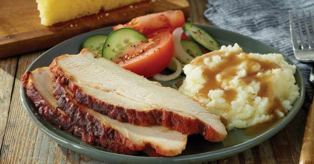 Turkey and mashed potatoes and veggies on plate